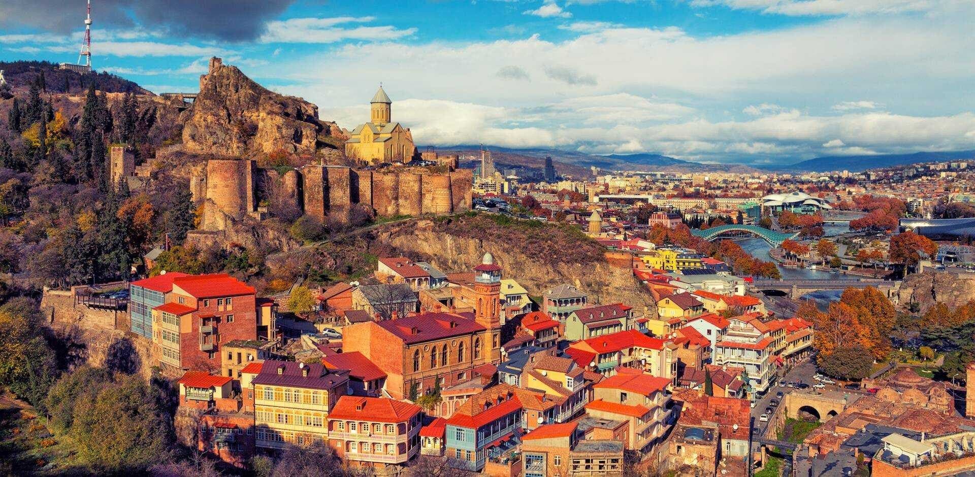 Old Tbilisi rooftops beneath the Caucasus