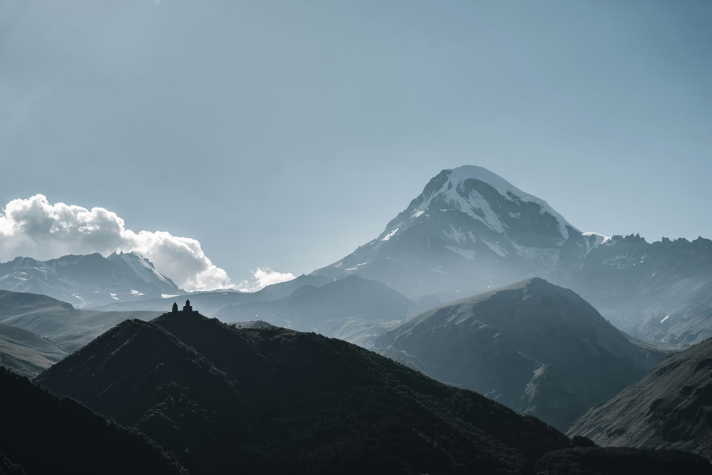 Gergeti Trinity Church silhouetted beneath Mount Kazbek